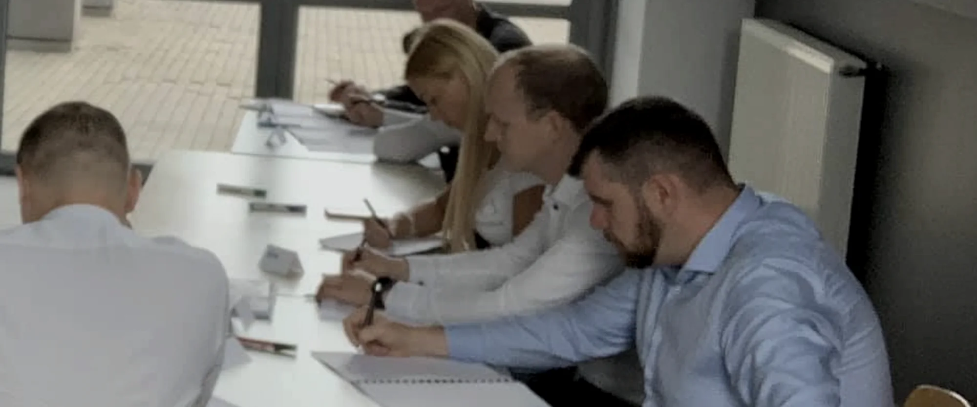 A sales team working through an exercise during a CCGROUP training session